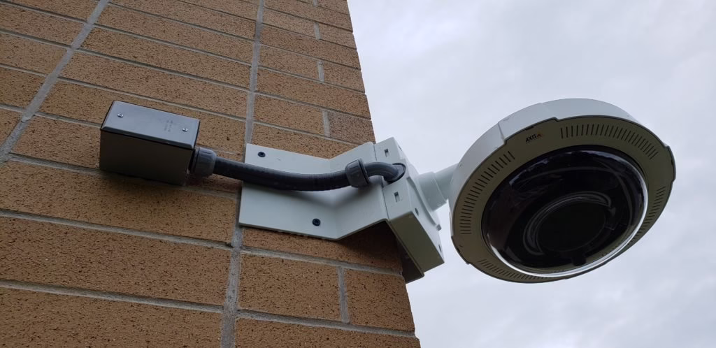 Axis multi-sensor camera on a wall arm mount