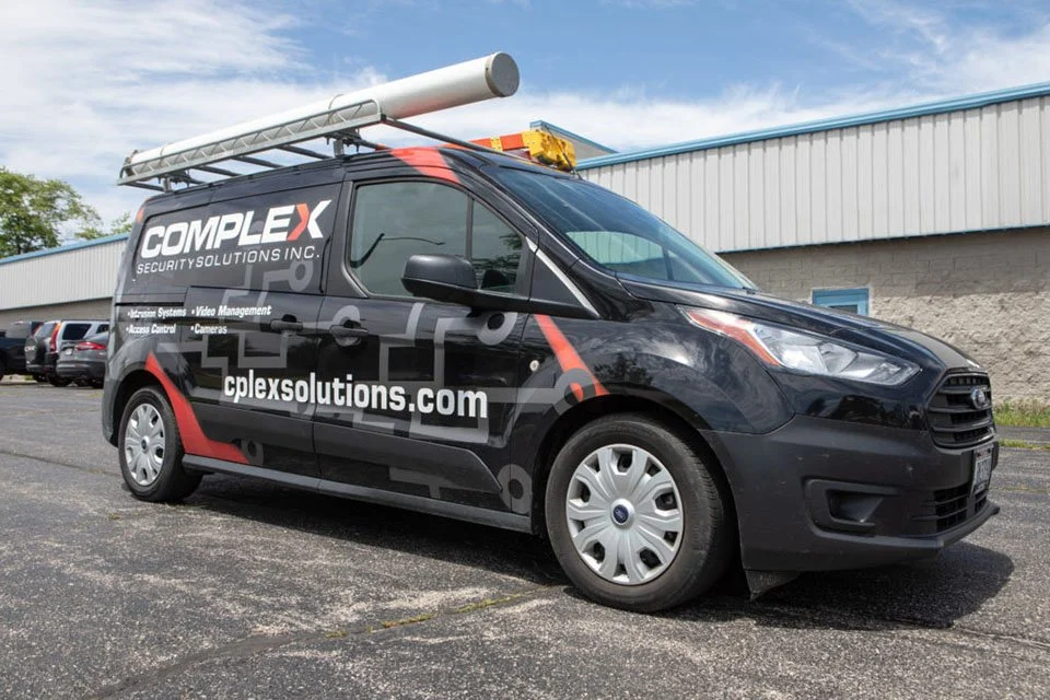 Complex Security Solutions van with ladder rack